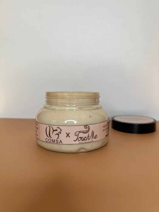 Jar of cream with a label on a beige surface