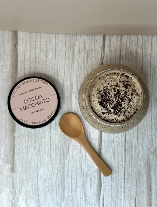 Cocoa macchiato product with a wooden spoon on a textured surface